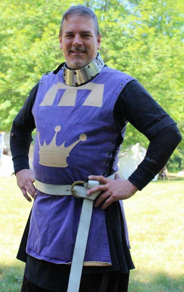 Prince Mohammad dressed in Purple tunic